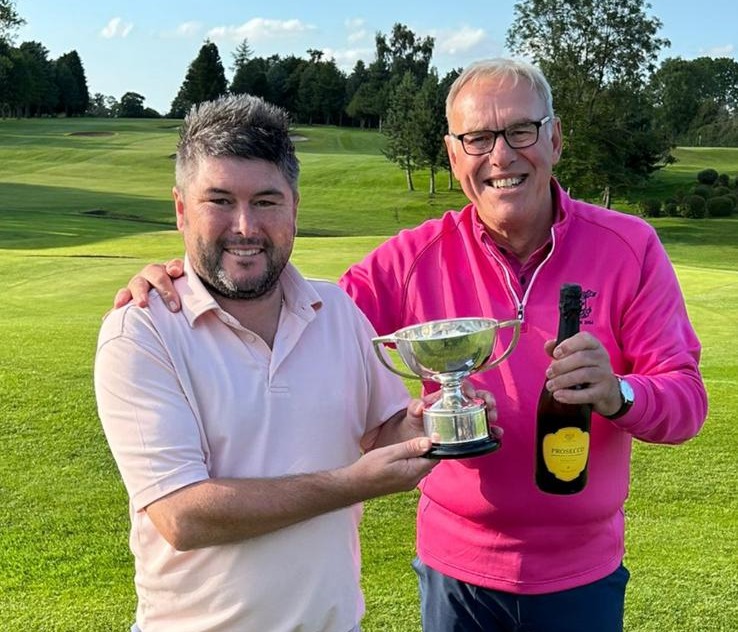 Martin Betts receives the Club Champion Trophy from Captain Rob Thomas