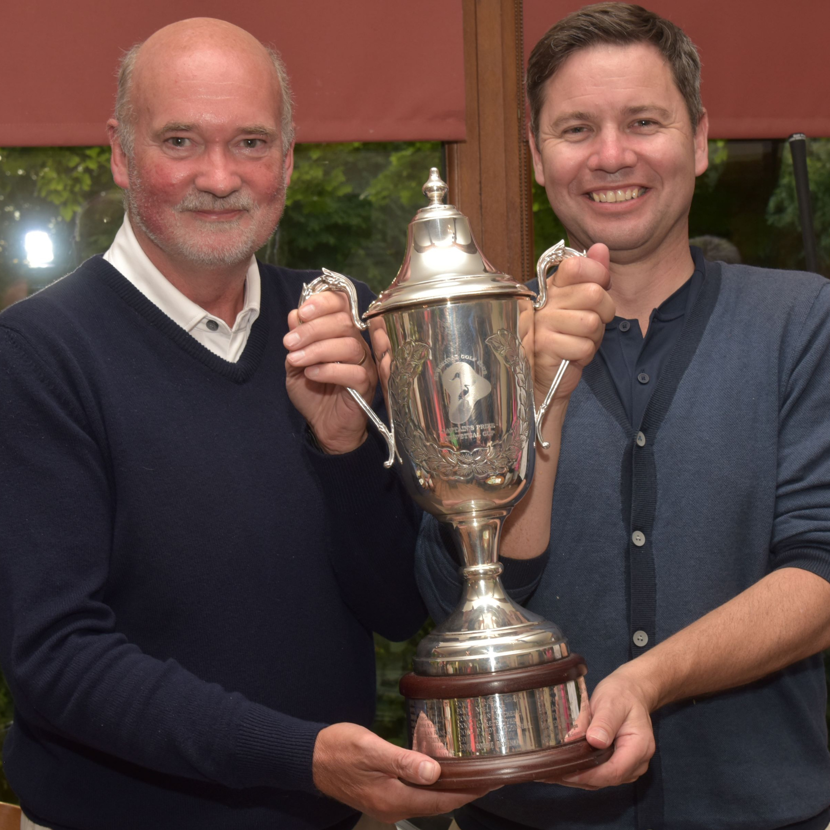 2024 Captains Prize Winner Tadhg O'Connor presented with Captains Cup by Peter Minnock (Captain)