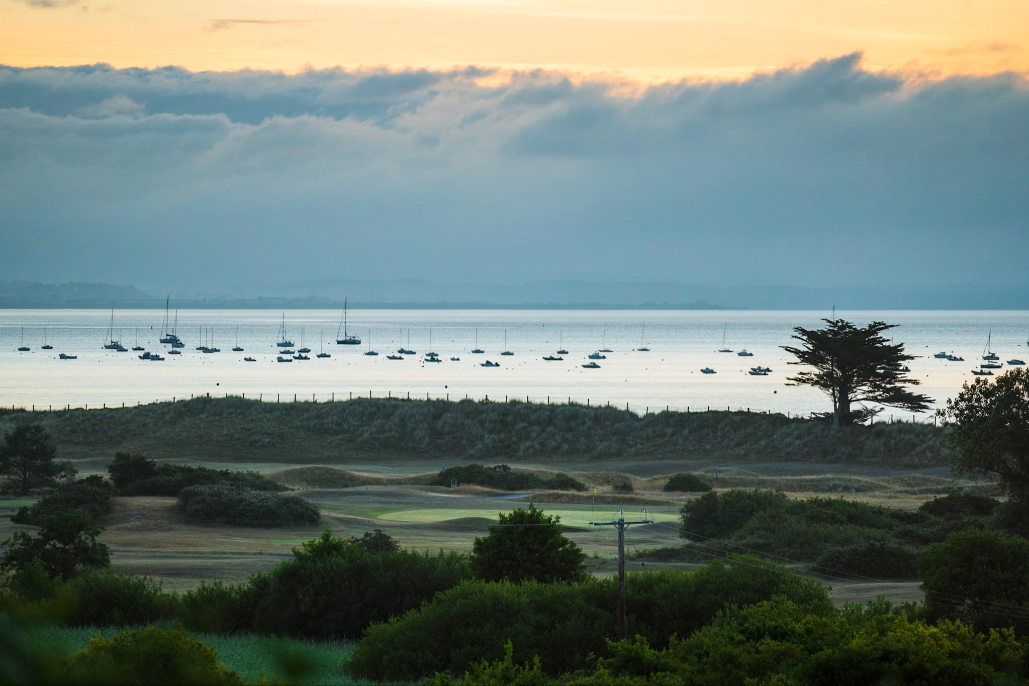 An early morning view over the course, the bay at Abersoch and Eryri mountains in the distance.